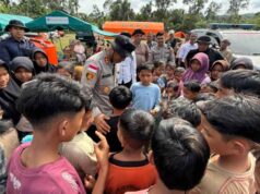 Kapolres Lhokseumawe Gelar Trauma Healing dan Pengobatan Gratis Bagi Pengungsi Banjir di Riseh Tunong
